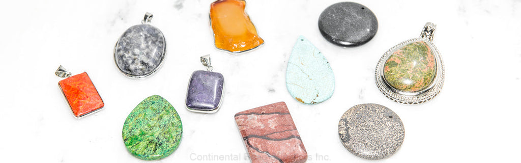 Assorted natural stone pendants featuring semi-precious gemstones with and without bezels